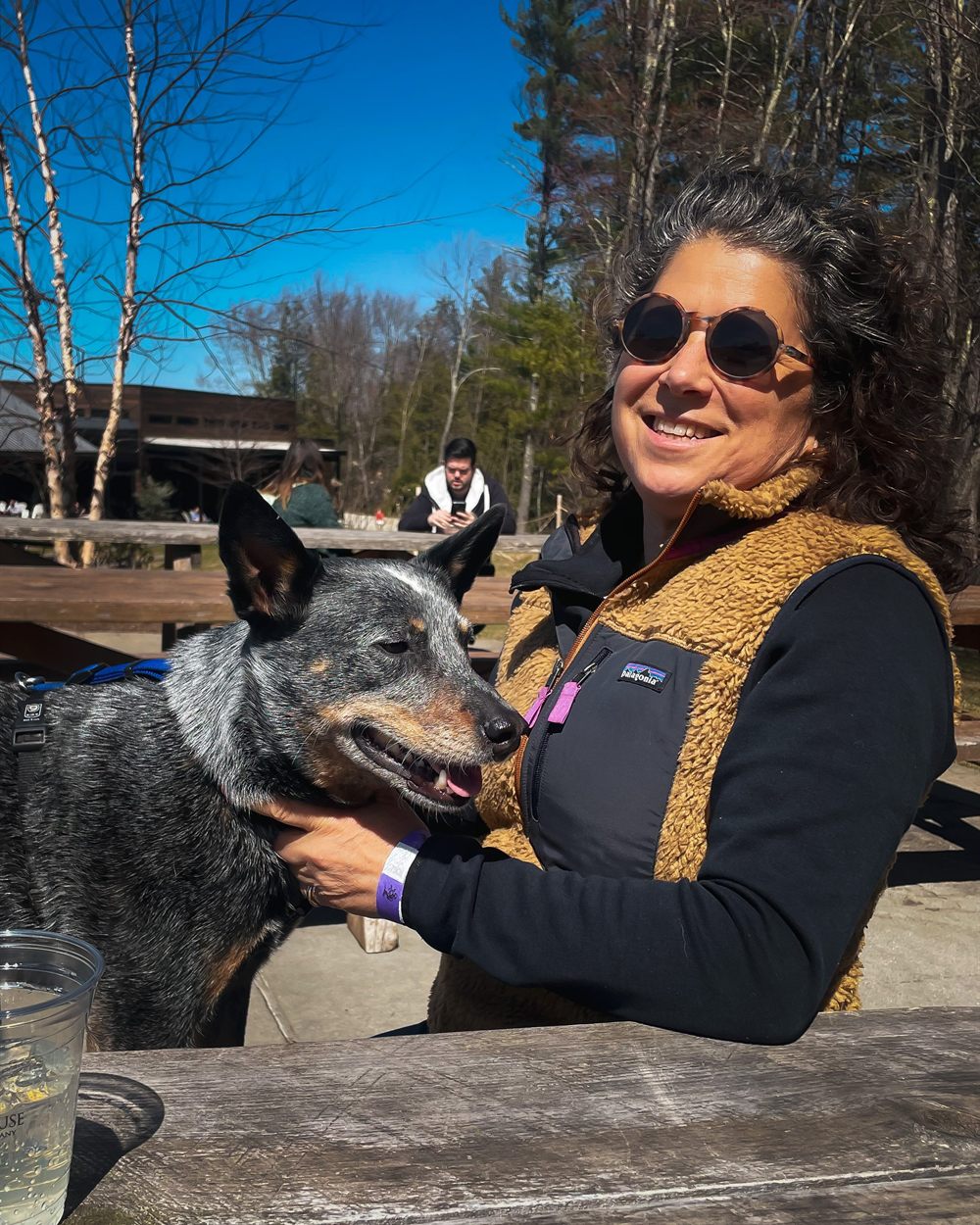 Polly Kaplan outdoors with her Australian cattle dog